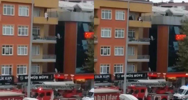 Polisin intihar etmek için balkona çıkan kadını kurtardığı anlar kamerada
